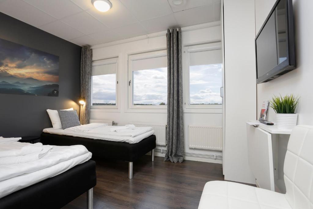 Postel nebo postele na pokoji v ubytování Hotel Vindeus