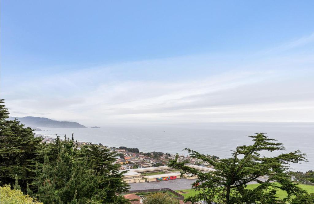 a view of a city and the ocean at @ Marbella Lane Top Coastline Views, Family Friendly in Pacifica