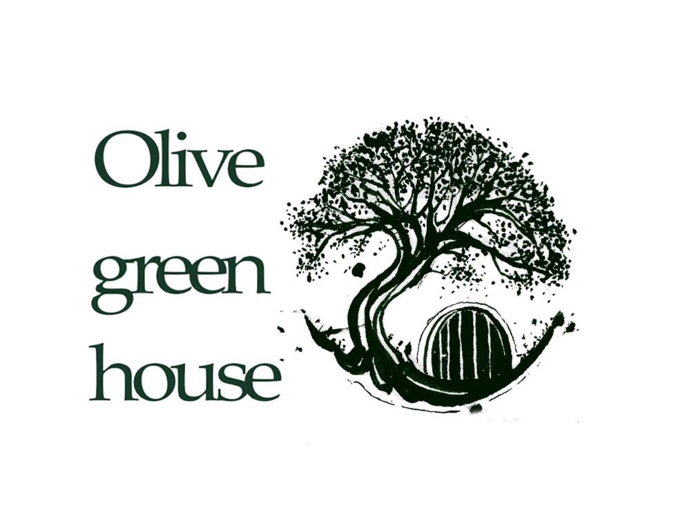 un'immagine di un albero con le parole "casa viva e verde" di Olive green house ad Agia Pelagia