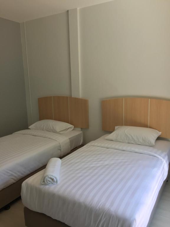 Postel nebo postele na pokoji v ubytování Bulan Villa rayong