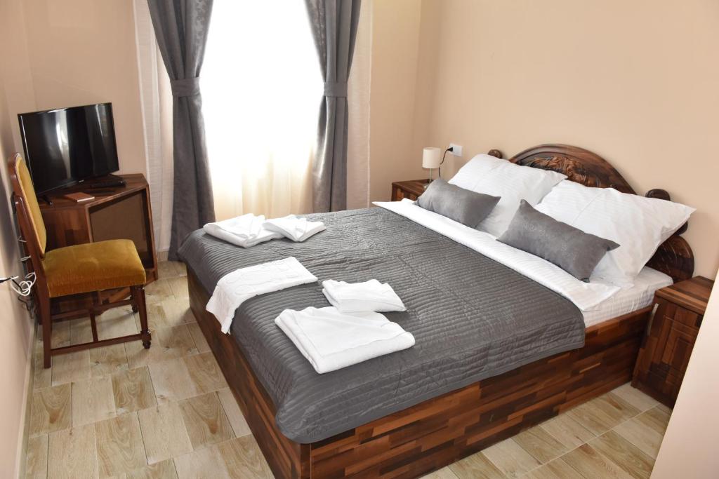 Postel nebo postele na pokoji v ubytování Hotel "VIR"