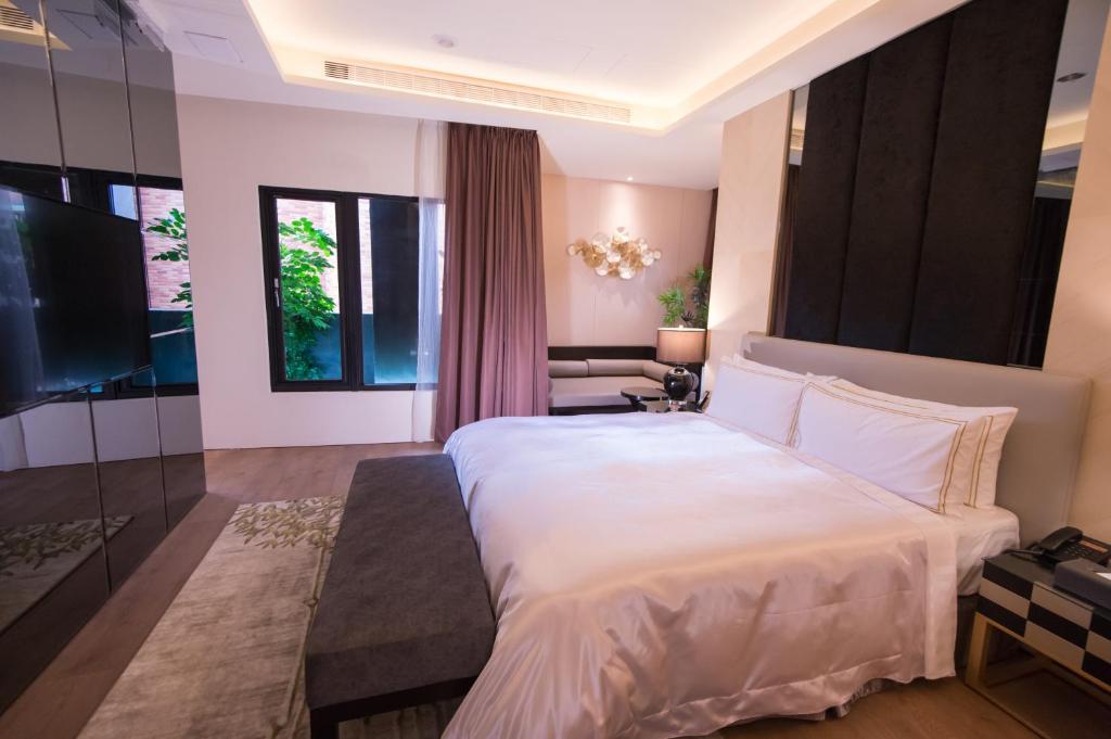 Postel nebo postele na pokoji v ubytování J Moon Villa Motel