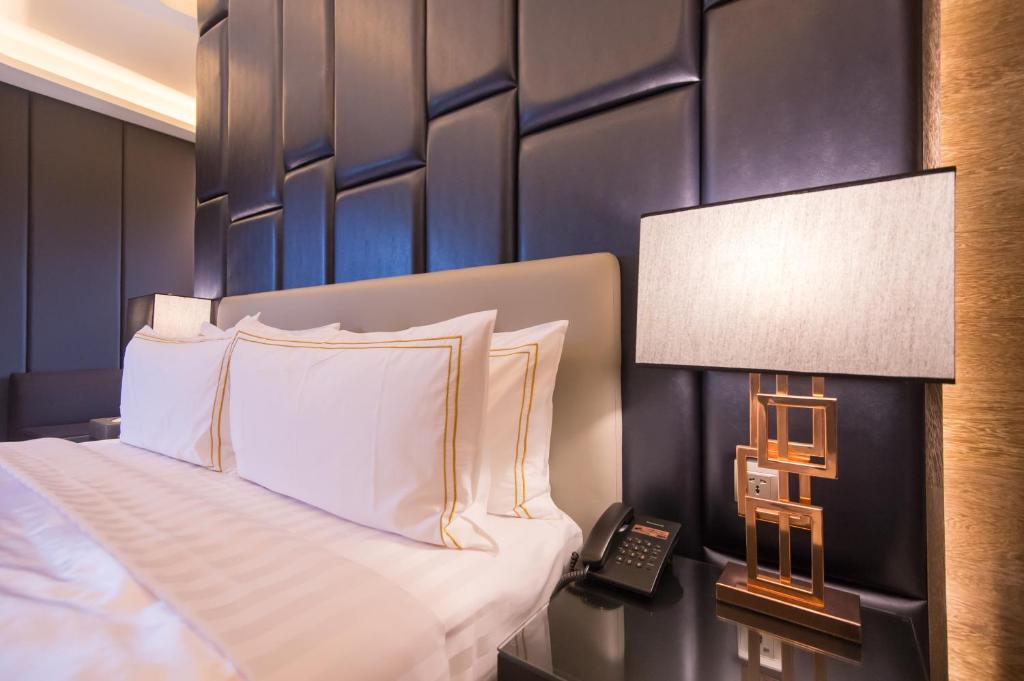 Postel nebo postele na pokoji v ubytování J Moon Villa Motel