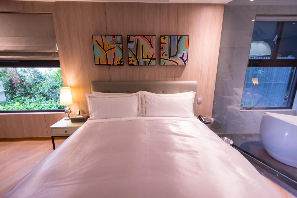 Postel nebo postele na pokoji v ubytování J Moon Villa Motel