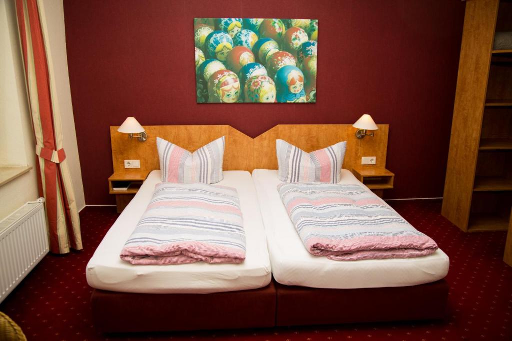 Postel nebo postele na pokoji v ubytování Hotel Perler Hof