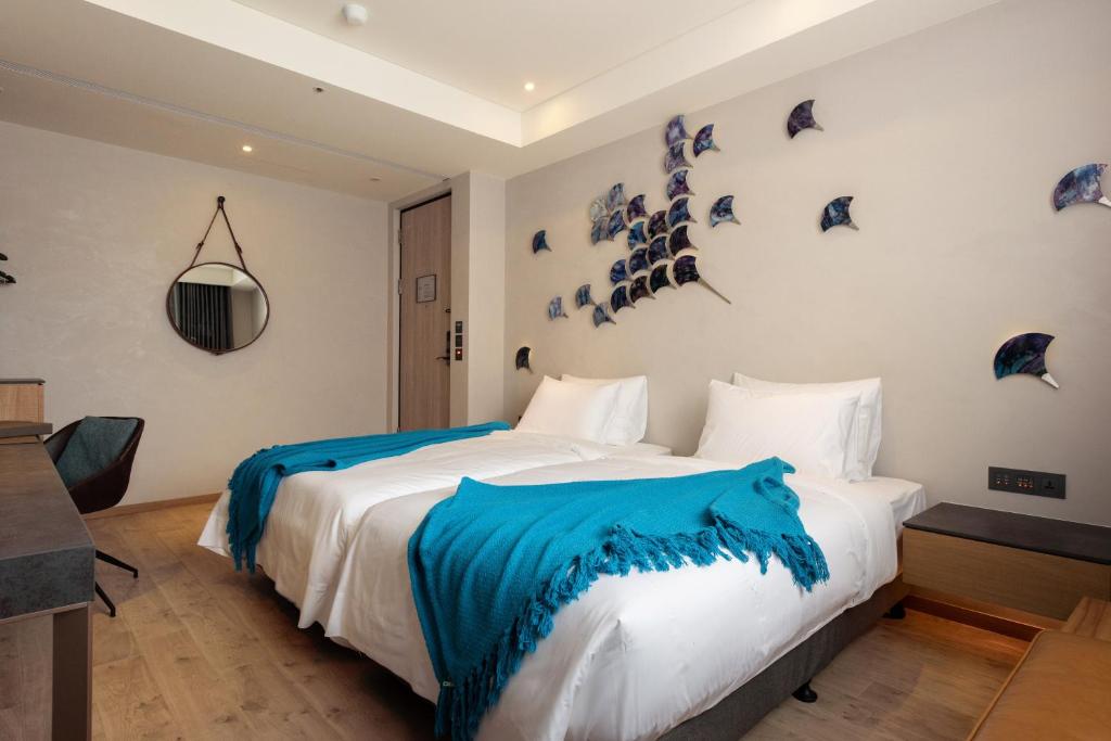 Postel nebo postele na pokoji v ubytování Brio Hotel