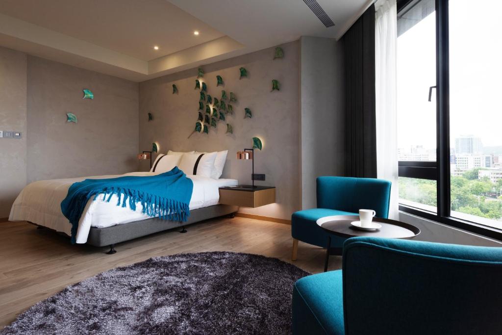 Postel nebo postele na pokoji v ubytování Brio Hotel