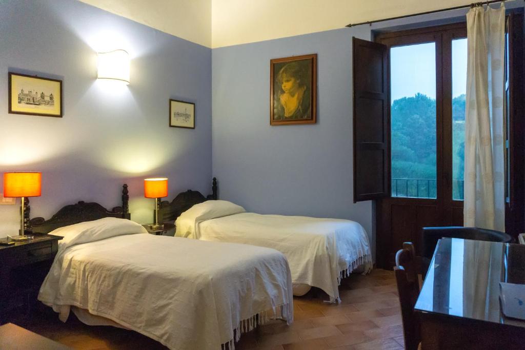 Postel nebo postele na pokoji v ubytování Villa Trigona