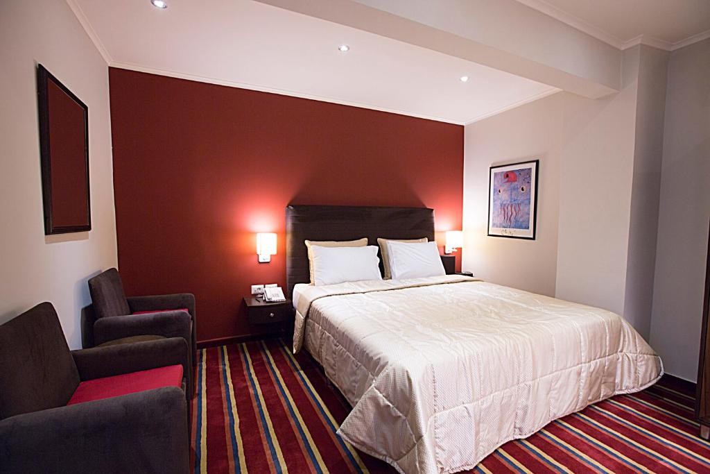 Postel nebo postele na pokoji v ubytování The J Hotel & Spa