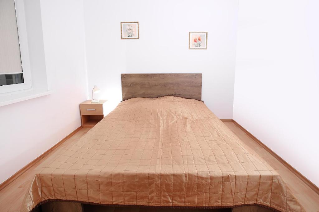 Posteľ alebo postele v izbe v ubytovaní 100-SIO Apartamenty