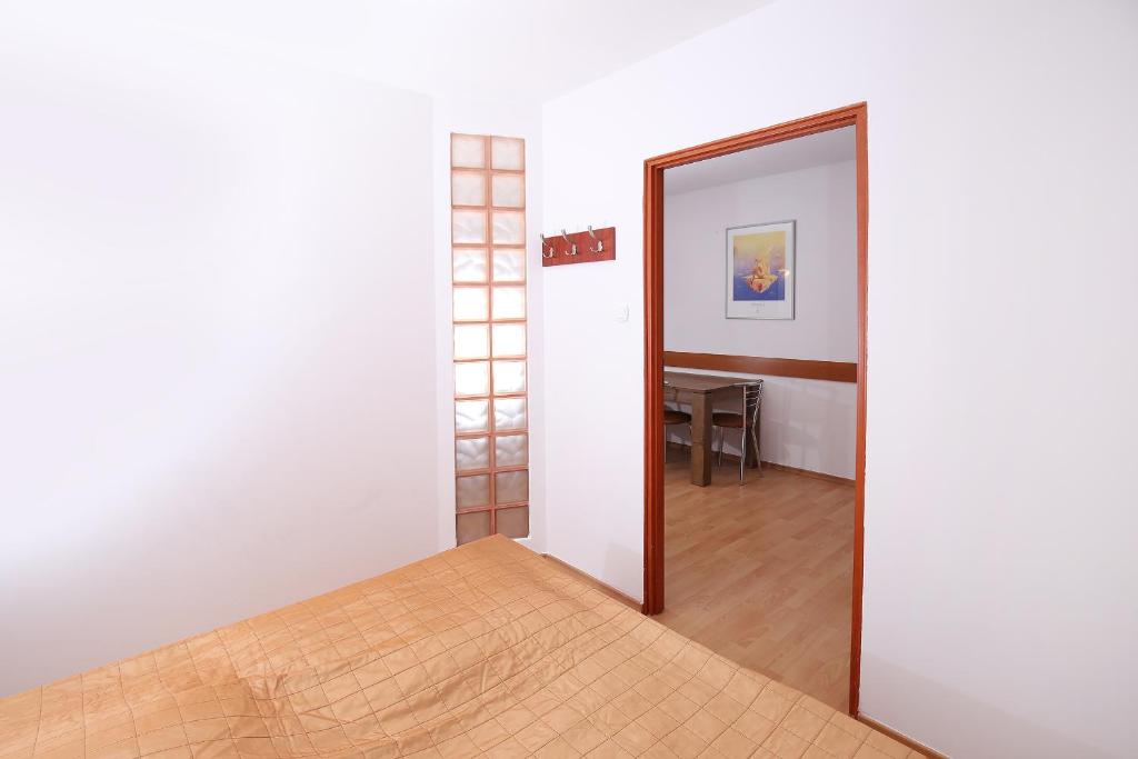Posteľ alebo postele v izbe v ubytovaní 100-SIO Apartamenty