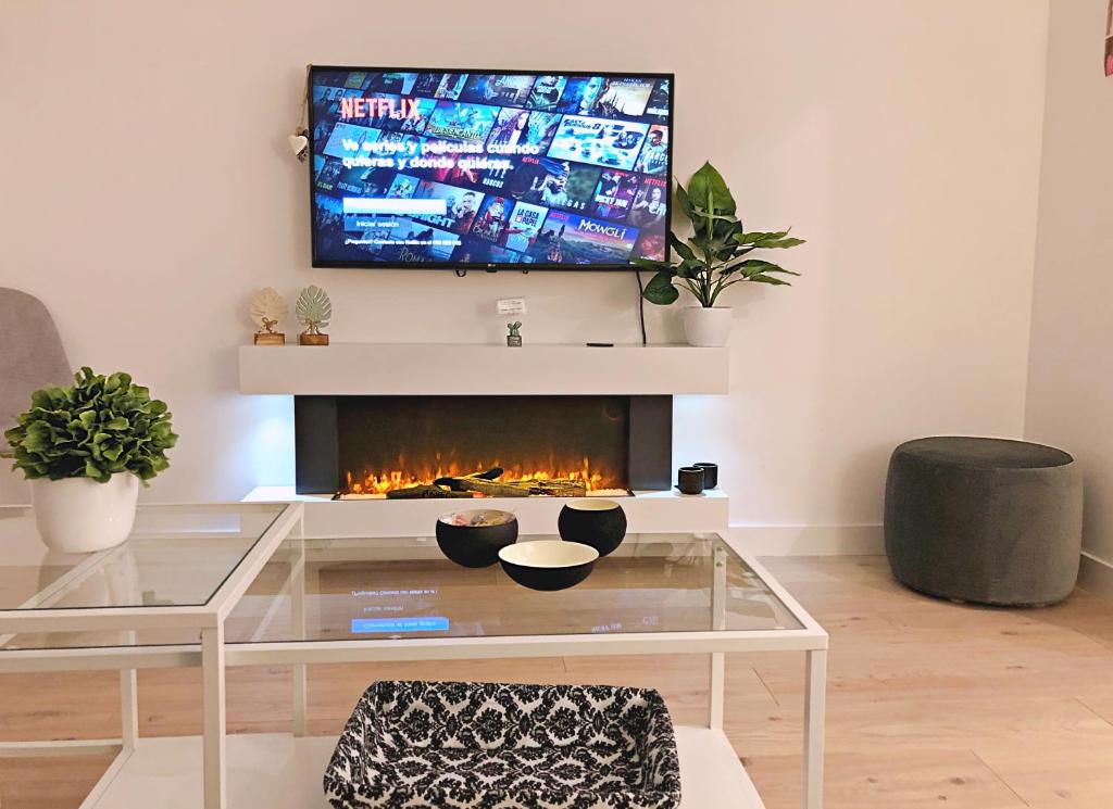 TV a/nebo společenská místnost v ubytování EXCLUSIVO Y LUMINOSO PISO EN EL PARQUE DEL RETIRO