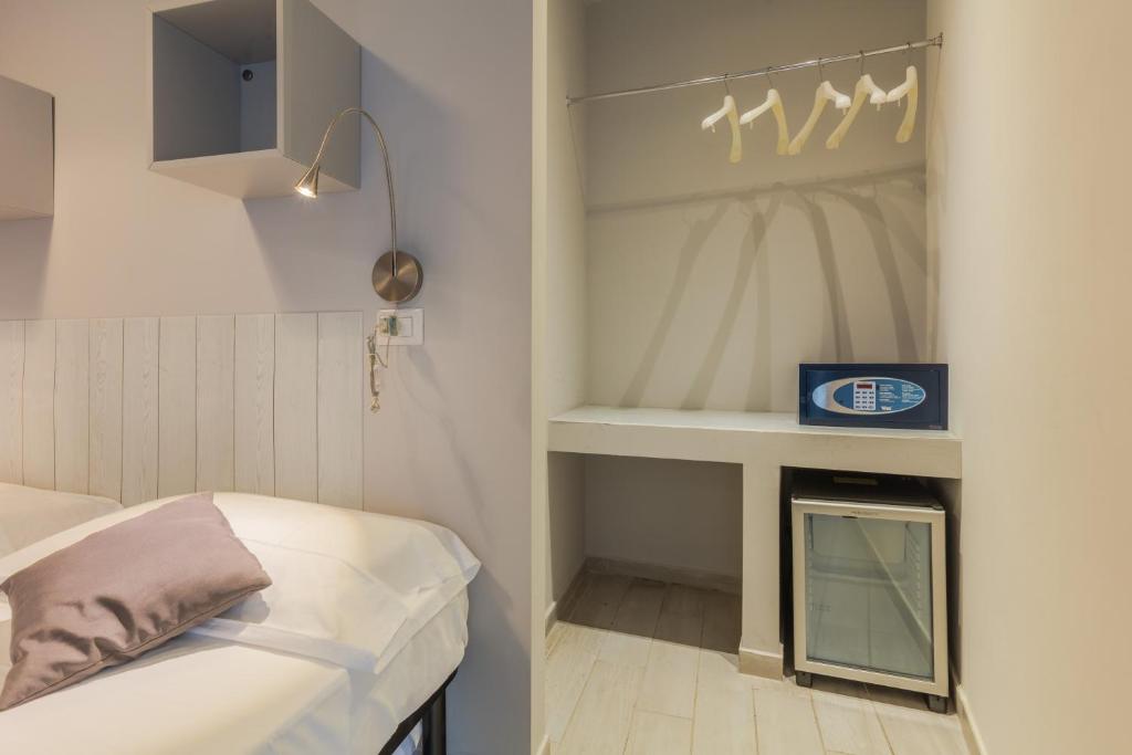 Postel nebo postele na pokoji v ubytování Hotel Viterbo Inn
