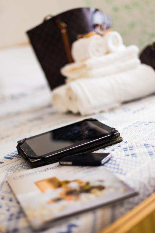 A bed or beds in a room at Hotel Lucerna