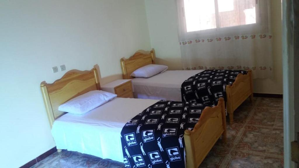 Postel nebo postele na pokoji v ubytování Appartement alhoceima