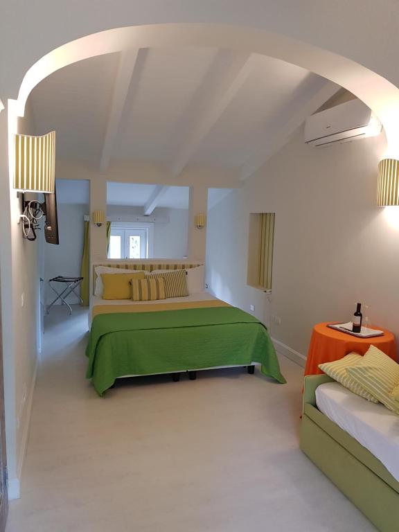 Postel nebo postele na pokoji v ubytování Villa Don Camillo
