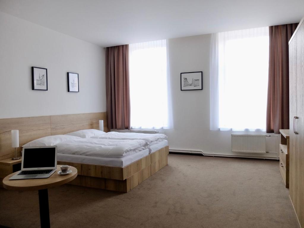Postel nebo postele na pokoji v ubytování Penzion Stará pošta