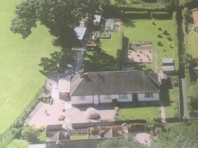 an aerial view of a house with a yard at 11 Callow Crescent in Minsterley