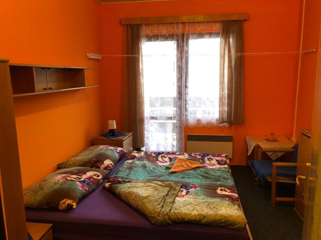 Postel nebo postele na pokoji v ubytování Hotel Na Trojce