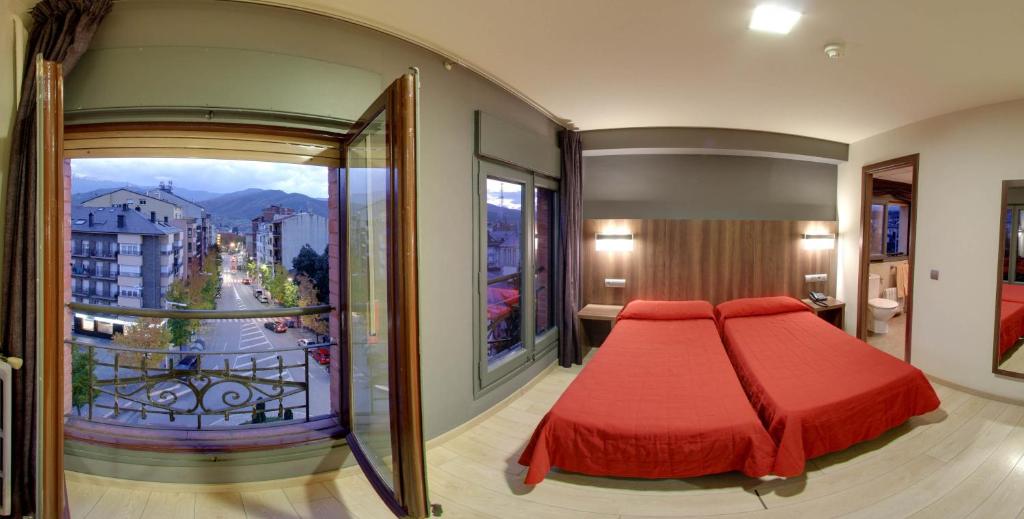Postel nebo postele na pokoji v ubytování Hotel Avenida