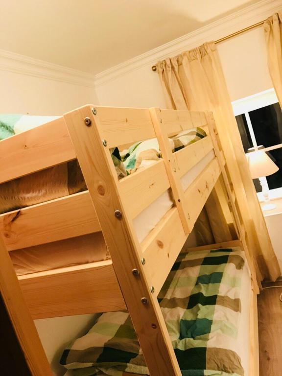 A bed or beds in a room at Malerwinkel, Forsthaus