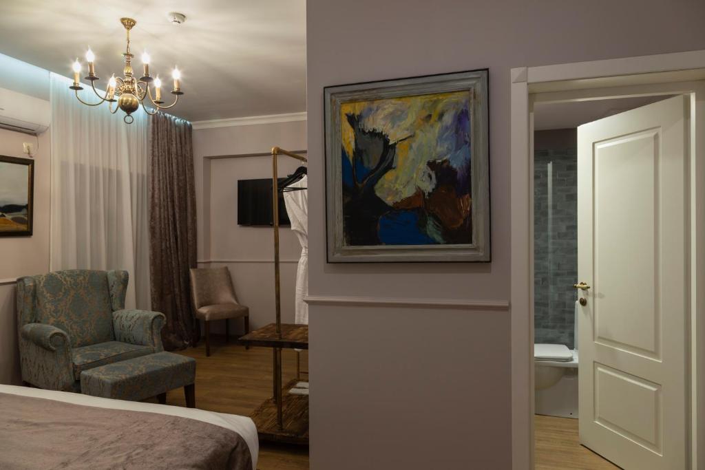 Postel nebo postele na pokoji v ubytování Omart Hotel - Gallery