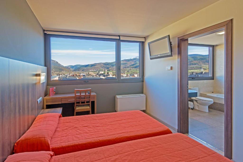 Postel nebo postele na pokoji v ubytování Hotel Avenida