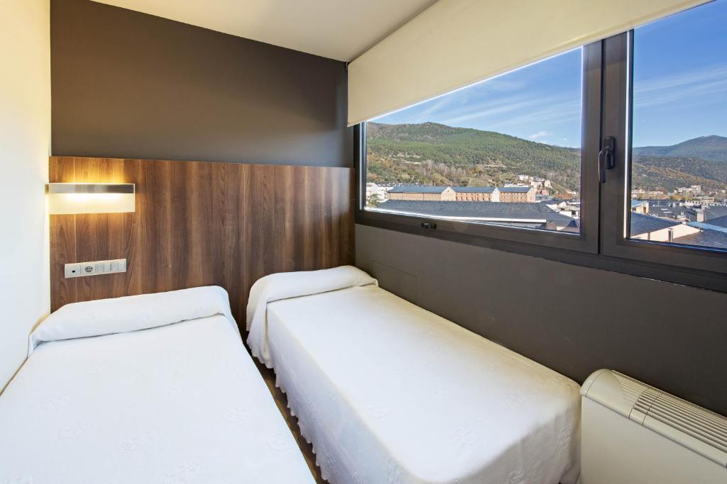 Postel nebo postele na pokoji v ubytování Hotel Avenida