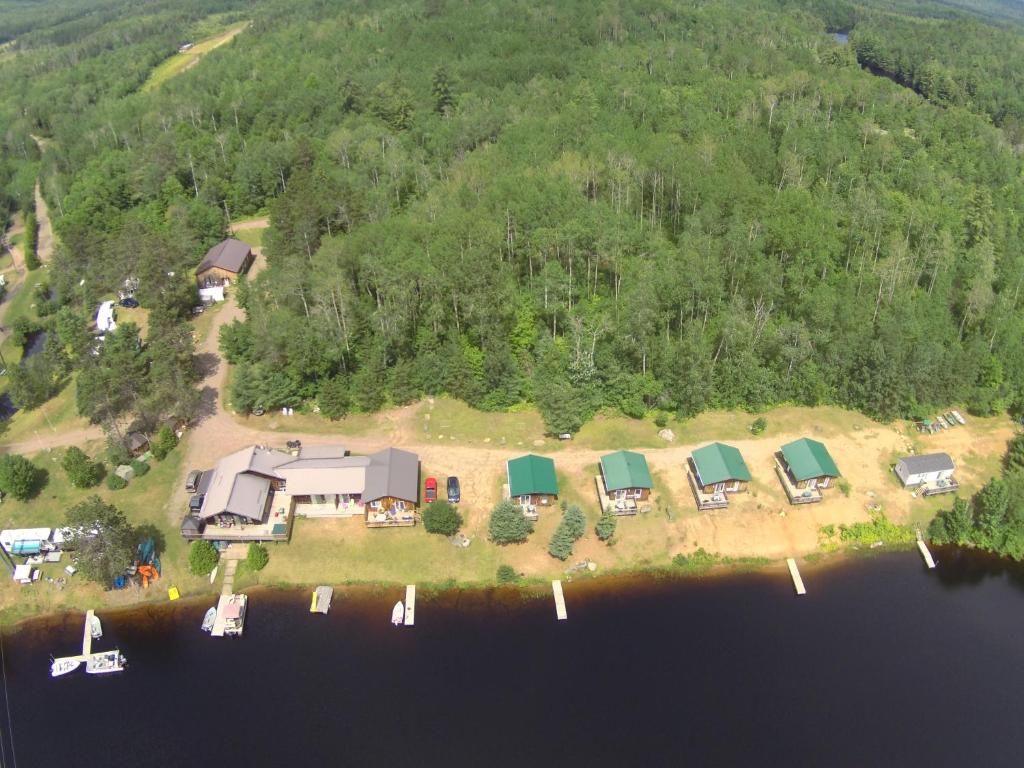 an aerial view of a house on an island in the water at All Star Resort in Madawaska