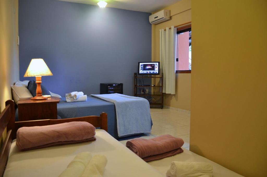 Postel nebo postele na pokoji v ubytování Pousada Bem Búzios