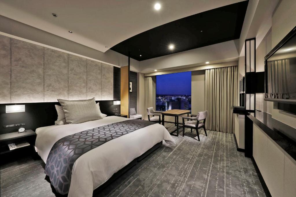 Postel nebo postele na pokoji v ubytování Hotel Granvia Kyoto