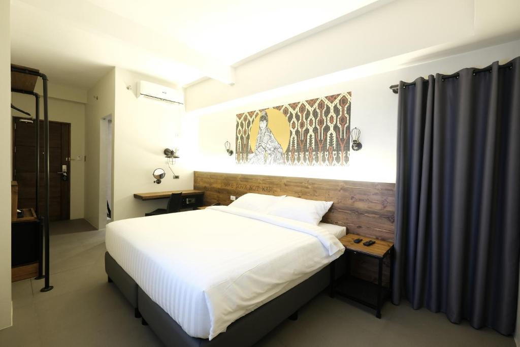 Postel nebo postele na pokoji v ubytování U Hotels Makati
