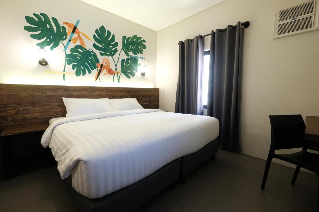Postel nebo postele na pokoji v ubytování U Hotels Makati