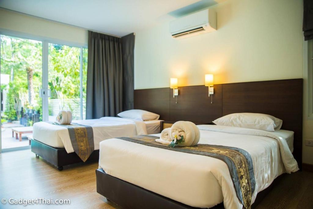 Postel nebo postele na pokoji v ubytování Baan Klang Aow Beach Resort