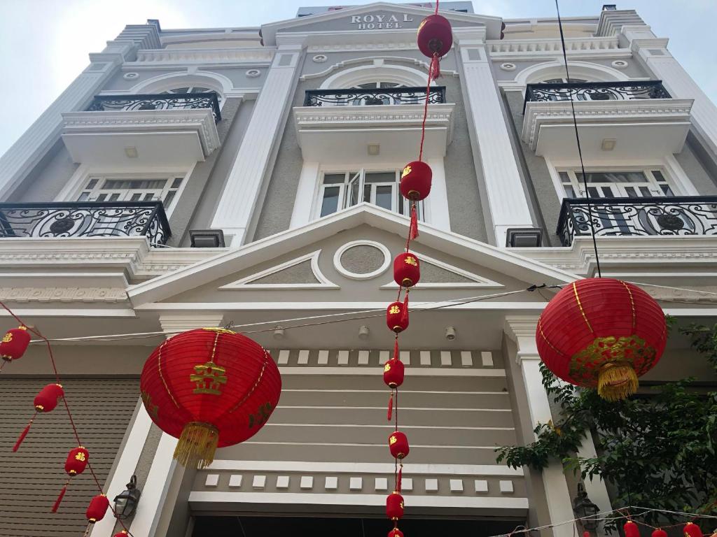 a building with red lanterns in front of it at Royal Hotel in Ho Chi Minh City