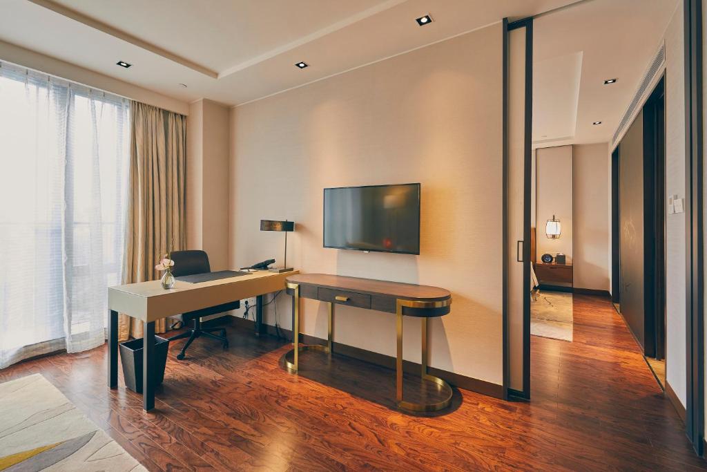 TV a/nebo společenská místnost v ubytování LJZ Supreme Tower Hotel