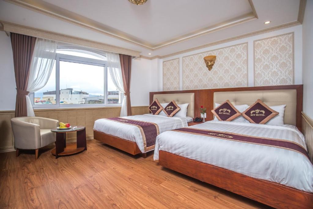 Postel nebo postele na pokoji v ubytování Roy Dala Hotel