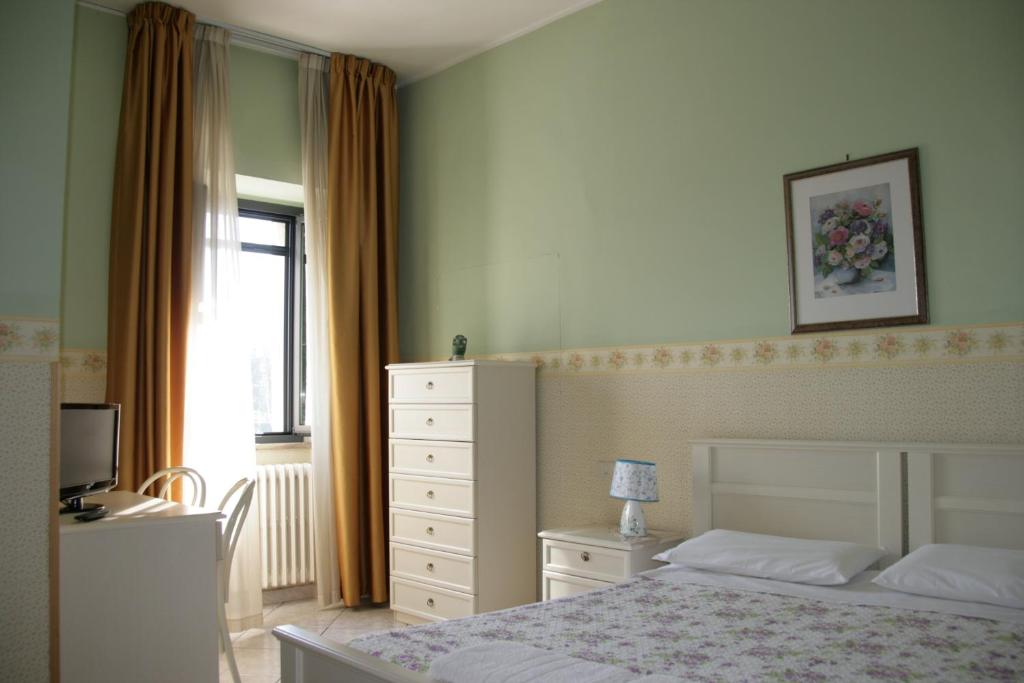 Posteľ alebo postele v izbe v ubytovaní Hotel La Villa