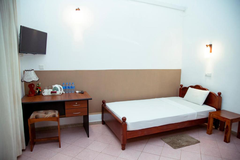 Postel nebo postele na pokoji v ubytování Prince Beach Hotel Bentota