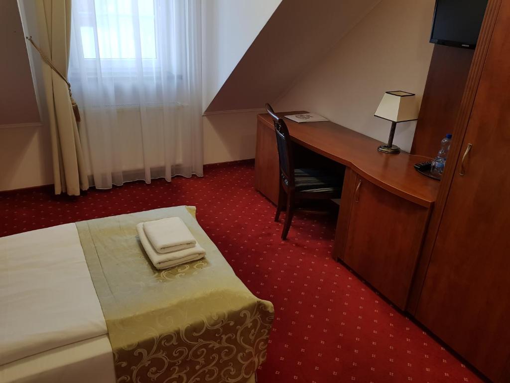 Posteľ alebo postele v izbe v ubytovaní Hotel Stara Gorzelnia
