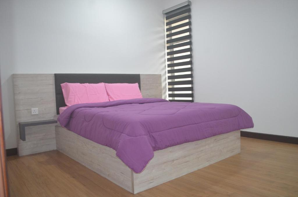 Cama o camas de una habitación en Zinnia Residence 5