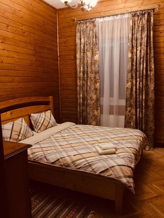 Postel nebo postele na pokoji v ubytování Візерунок