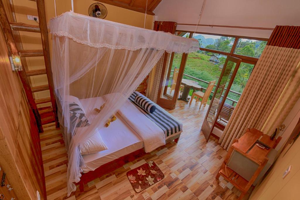 Postel nebo postele na pokoji v ubytování Ella 100 View Cottage