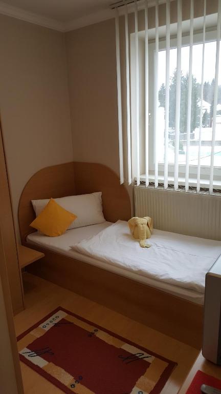 Postel nebo postele na pokoji v ubytování Hotel Baník Handlová