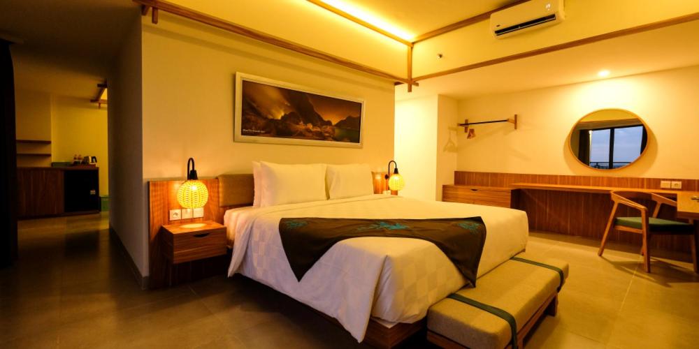 Voodi või voodid majutusasutuse ILLIRA Hotel Banyuwangi toas