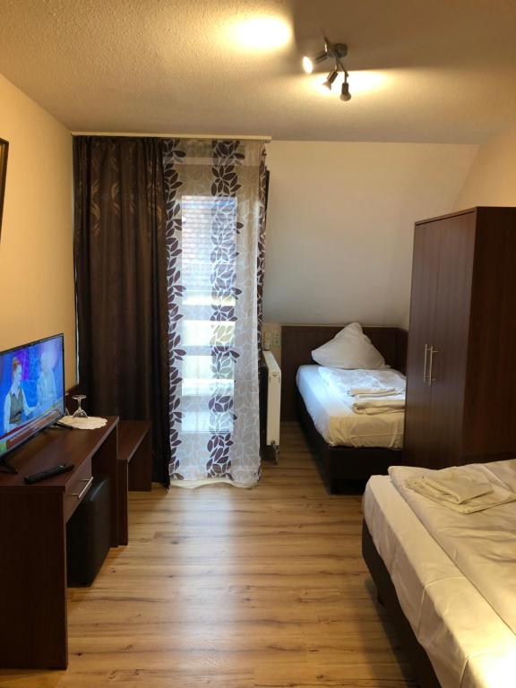 Postel nebo postele na pokoji v ubytování Hotel Poseidon