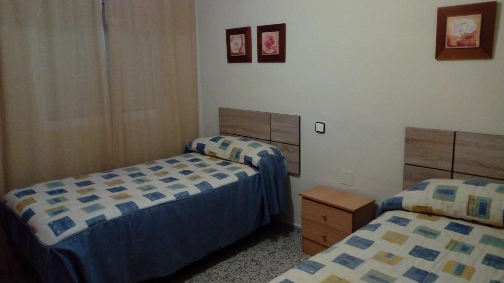 Posteľ alebo postele v izbe v ubytovaní Piso cerca mezquita