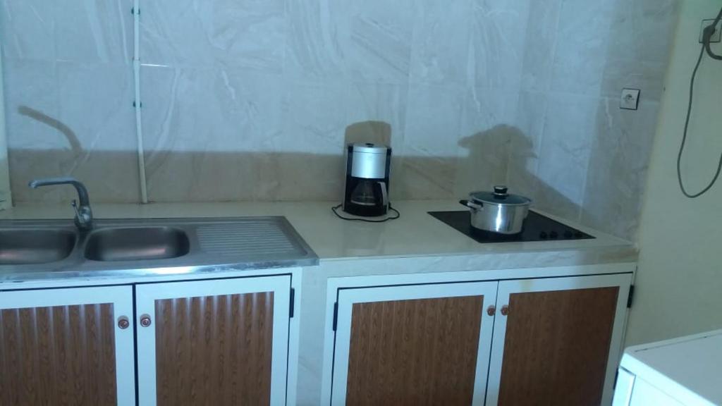 Kuchyň nebo kuchyňský kout v ubytování Appartement alhoceima