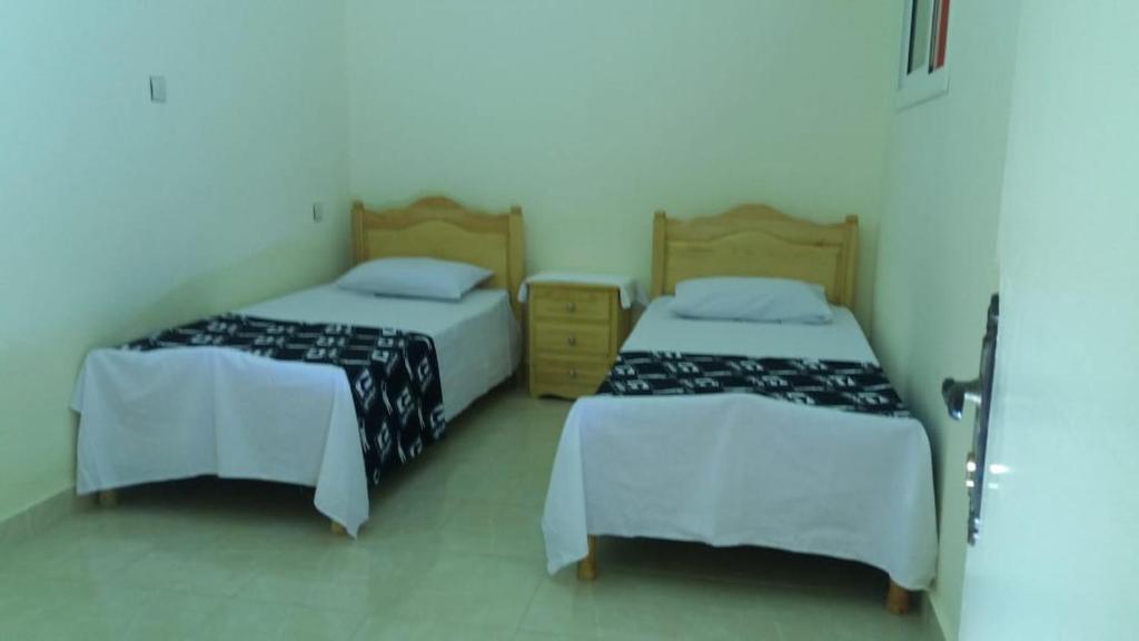 Postel nebo postele na pokoji v ubytování Appartement alhoceima