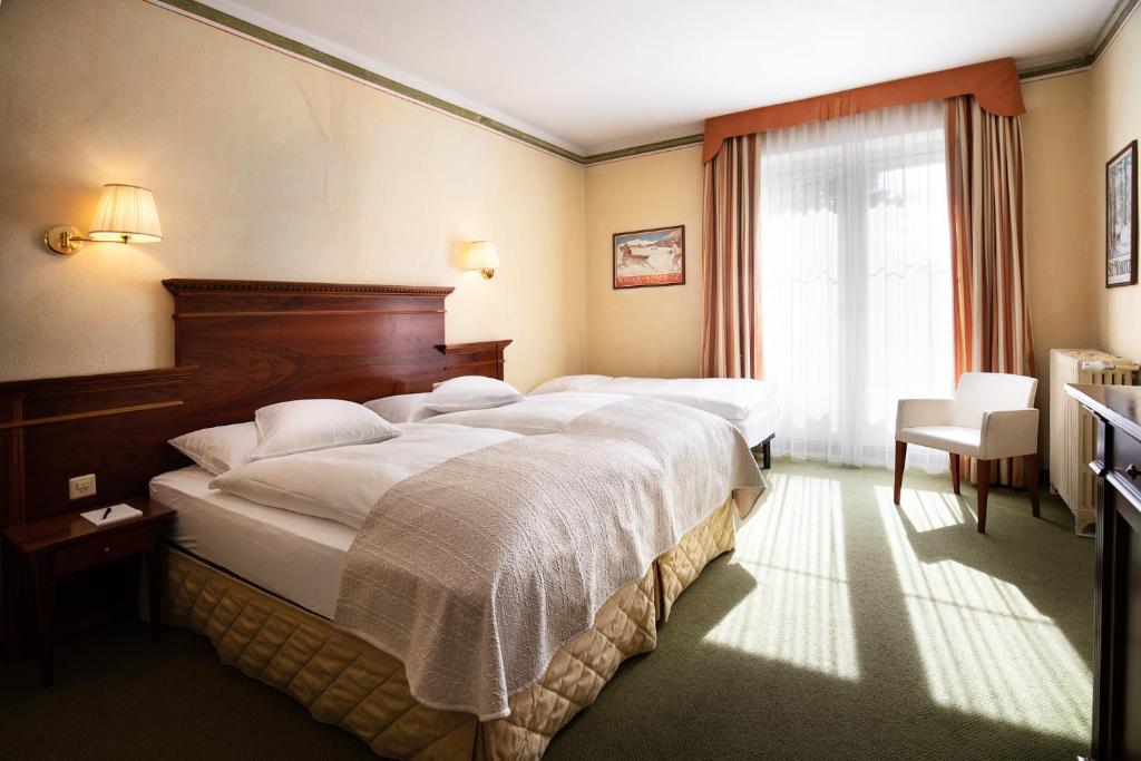 Letto o letti in una camera di Hotel Reine Victoria